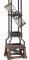 Hourglass and base detail of the Howard Miller Ironworks 615-074 Quartz Floor Clock