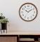 Room setting of the Bulova C4899 Clarity Minimalist Dark Walnut Wall Clock
